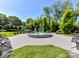Serene park featuring a decorative fountain surrounded by lush greenery and seating at 6531 Hazelton Dr, Charlotte, NC 28210