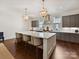 Stylish kitchen with a center island, pendant lights, and sleek cabinetry at 6531 Hazelton Dr, Charlotte, NC 28210