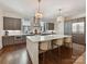 Modern kitchen with a large island, stainless steel appliances, and pendant lighting at 6531 Hazelton Dr, Charlotte, NC 28210