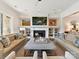 Spacious living room with a fireplace, custom built-ins, and comfortable seating at 6531 Hazelton Dr, Charlotte, NC 28210