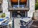 Spacious patio with outdoor seating, dining area, and an outdoor entertainment area at 6531 Hazelton Dr, Charlotte, NC 28210