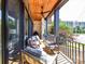 Inviting covered porch featuring comfortable seating and a ceiling fan for outdoor relaxation at 6531 Hazelton Dr, Charlotte, NC 28210