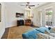 Warm sitting room with patio access, a ceiling fan, and comfortable furnishings at 6531 Hazelton Dr, Charlotte, NC 28210