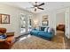 Bright sitting room with French doors to the patio and an additional seating area in the background at 6531 Hazelton Dr, Charlotte, NC 28210