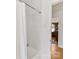 Bright bathroom features a shower-tub combination with white textured tile walls at 6745 Lancer Dr, Charlotte, NC 28226