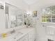 The bathroom features a large mirror and a white vanity with plenty of drawers for storage at 6745 Lancer Dr, Charlotte, NC 28226