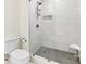 This bathroom features a walk-in shower with a glass door and a convenient shower seat at 6745 Lancer Dr, Charlotte, NC 28226