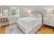 Bright bedroom featuring hardwood floors, natural light, and neutral tones at 6745 Lancer Dr, Charlotte, NC 28226