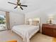 This bedroom features a ceiling fan and a door to the outside, plus a complementary rug and dresser at 6745 Lancer Dr, Charlotte, NC 28226