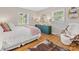 The bedroom features gleaming hardwood floors and two bright windows at 6745 Lancer Dr, Charlotte, NC 28226