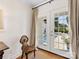 The door offers a bright view of the swimming pool, lounge chairs, and patio at 6745 Lancer Dr, Charlotte, NC 28226