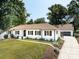 Beautiful home featuring a spacious driveway, attached garage, and professionally landscaped yard at 6745 Lancer Dr, Charlotte, NC 28226