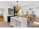 Bright kitchen with a central island, white cabinetry, and seamless flow to the adjacent living spaces at 6745 Lancer Dr, Charlotte, NC 28226