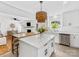 Well-appointed kitchen featuring a central island, white cabinets, and an open design for entertaining at 6745 Lancer Dr, Charlotte, NC 28226