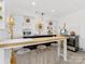 Modern kitchen area with stainless steel appliances, breakfast bar, and custom shelving at 6745 Lancer Dr, Charlotte, NC 28226