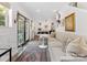 Cozy living room with a large sofa, dining area and a decorative rug at 6745 Lancer Dr, Charlotte, NC 28226