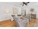 Inviting living room featuring hardwood floors, a stylish console, and comfortable seating for relaxing at 6745 Lancer Dr, Charlotte, NC 28226