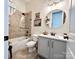 This bathroom includes a combined shower and tub with a white sink and vanity at 7076 Brookstone Ln, Fort Mill, SC 29707