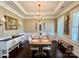 Formal dining room with hardwood floors, wainscoting, and a chandelier at 7076 Brookstone Ln, Fort Mill, SC 29707