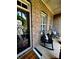 Inviting front porch with rocking chairs, brick facade, and a decorative wreath at 7076 Brookstone Ln, Fort Mill, SC 29707