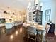 Open-concept kitchen and dining area with hardwood floors and modern fixtures at 7076 Brookstone Ln, Fort Mill, SC 29707