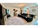 A spacious living room features a leather couch, a pool table, and unique decor at 7076 Brookstone Ln, Fort Mill, SC 29707
