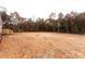 Expansive backyard with view of the treeline offering a peaceful retreat for relaxation or outdoor activities near main home at 716 Sharon Ln, Iron Station, NC 28080