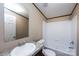 Well-lit bathroom features a single sink vanity, a large mirror, and a shower and tub combination at 716 Sharon Ln, Iron Station, NC 28080