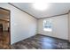 This comfortable bedroom features wood-look flooring and a large window for plenty of natural light at 716 Sharon Ln, Iron Station, NC 28080