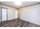 Bright bedroom with wood-look flooring, a closet, and ample space for personalization at 716 Sharon Ln, Iron Station, NC 28080