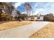 The house's exterior is complemented by a well-maintained front yard and a concrete driveway at 716 Sharon Ln, Iron Station, NC 28080