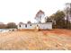 Charming single-story home featuring durable siding, a welcoming front porch, and a well-maintained yard at 716 Sharon Ln, Iron Station, NC 28080