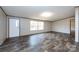 Bright living room featuring neutral walls, and plank flooring at 716 Sharon Ln, Iron Station, NC 28080