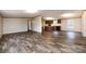 Spacious living room featuring neutral walls, and plank flooring at 716 Sharon Ln, Iron Station, NC 28080