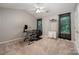 Bright bedroom featuring a ceiling fan, plush carpet, and neutral walls creating a comfortable atmosphere at 7518 Silver Arrow Dr, Charlotte, NC 28273