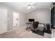 Neutral bedroom with computer desk and ensuite bathroom at 7518 Silver Arrow Dr, Charlotte, NC 28273