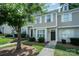 Inviting townhome with lush lawn and sidewalk, showcasing curb appeal at 7518 Silver Arrow Dr, Charlotte, NC 28273
