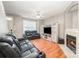 Relaxing living room featuring a fireplace, entertainment center, and comfortable couches at 7518 Silver Arrow Dr, Charlotte, NC 28273