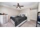 Spacious main bedroom featuring a ceiling fan, a cozy bed, and carpet floors at 7518 Silver Arrow Dr, Charlotte, NC 28273