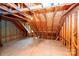 Bright attic space with wooden rafters, providing ample room for storage or future expansion at 7554 Bluestar Ln, Charlotte, NC 28226