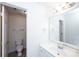 Well-lit bathroom featuring a toilet, sink, vanity with mirror and lighting at 7554 Bluestar Ln, Charlotte, NC 28226