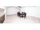 Open floor plan with a dining area featuring a wood table and six chairs at 7554 Bluestar Ln, Charlotte, NC 28226