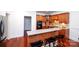 Open kitchen with granite countertops, stainless appliances, and a breakfast bar with seating at 7554 Bluestar Ln, Charlotte, NC 28226
