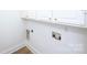 Laundry room hookups provide water and power access for washer and dryer at 7554 Bluestar Ln, Charlotte, NC 28226