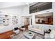 Stylish living room featuring built-in shelves and an open view to the kitchen at 7554 Bluestar Ln, Charlotte, NC 28226