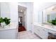 Bright main bathroom features double vanity sinks and white cabinets at 7554 Bluestar Ln, Charlotte, NC 28226