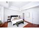 Bright main bedroom features a ceiling fan, tray ceiling and neutral colors at 7554 Bluestar Ln, Charlotte, NC 28226