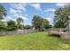 Expansive backyard with a wooden deck and full perimeter fencing, perfect for outdoor living and privacy at 810 4Th St, Kings Mountain, NC 28086