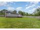 Spacious grassy backyard featuring a wooden deck, providing ample outdoor space at 810 4Th St, Kings Mountain, NC 28086