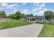 Property featuring a long driveway leading to the house, complemented by a spacious grassy yard at 810 4Th St, Kings Mountain, NC 28086
